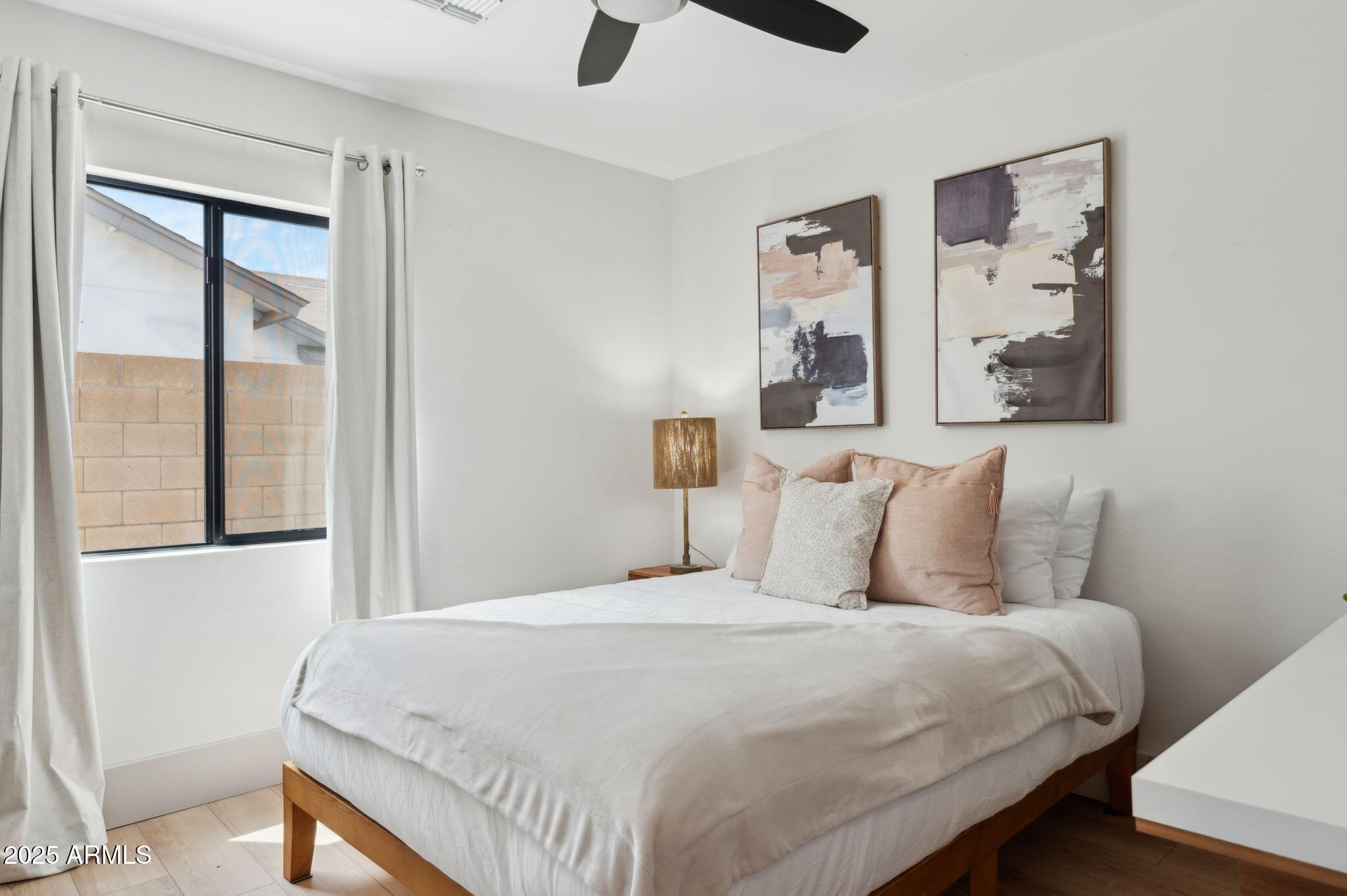 5301 East Tierra Buena Lane Scottsdale, AZ 85254 - Photo 29 of 61 a bedroom with a large bed and a window
