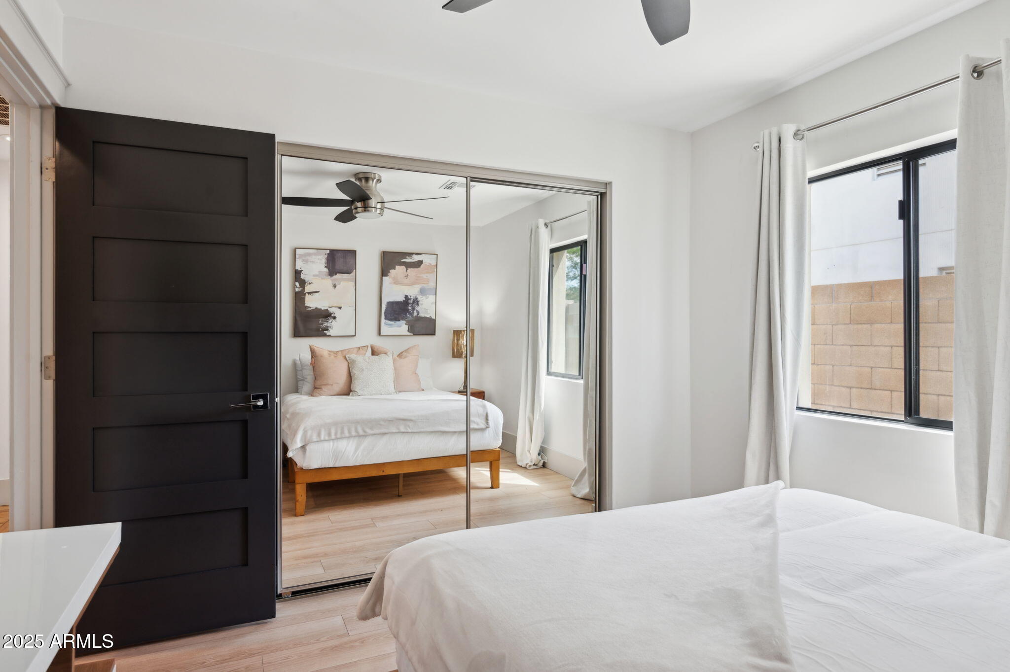 5301 East Tierra Buena Lane Scottsdale, AZ 85254 - Photo 31 of 61 a bedroom with a bed and a window