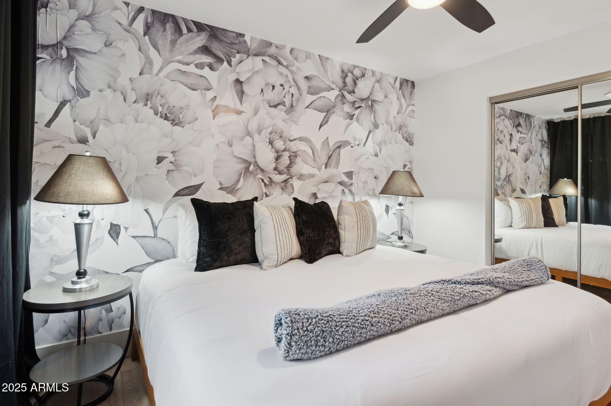 5301 East Tierra Buena Lane Scottsdale, AZ 85254 - Photo 34 of 61 a large bed sitting in a bedroom next to a lamp