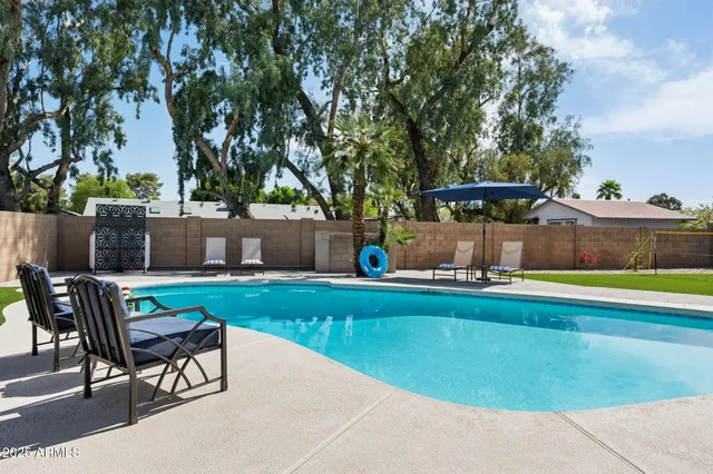 a view of yard with patio