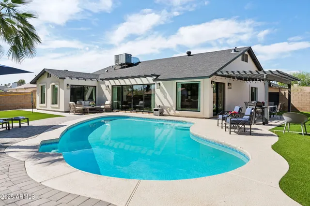 a view of backyard with outdoor seating
