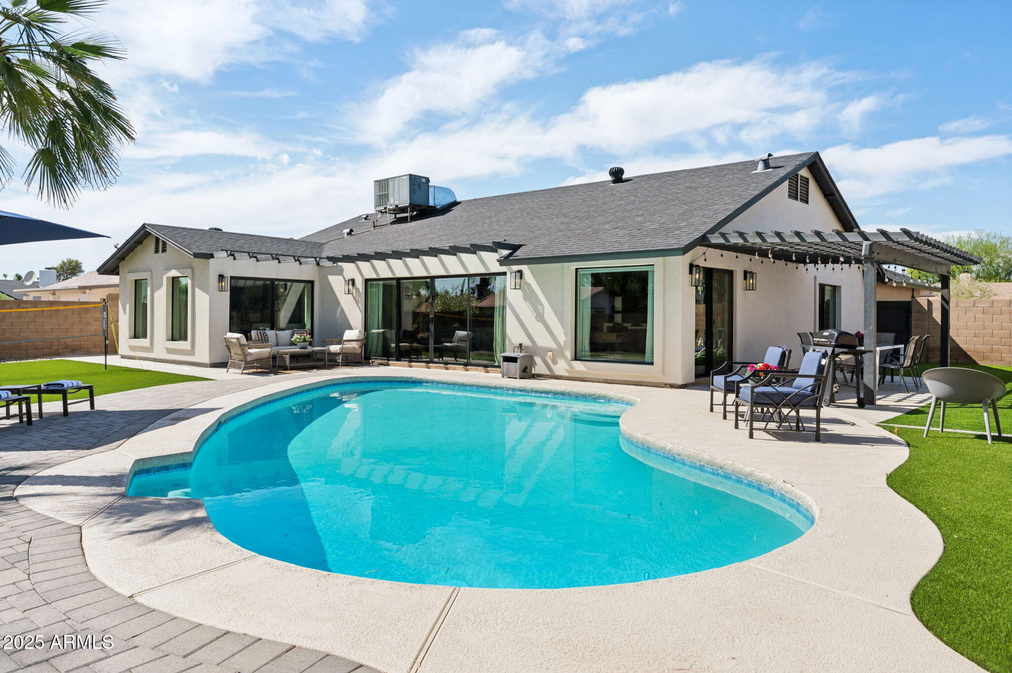 5301 East Tierra Buena Lane Scottsdale, AZ 85254 - Photo 40 of 61 a view of a house with swimming pool and sitting area