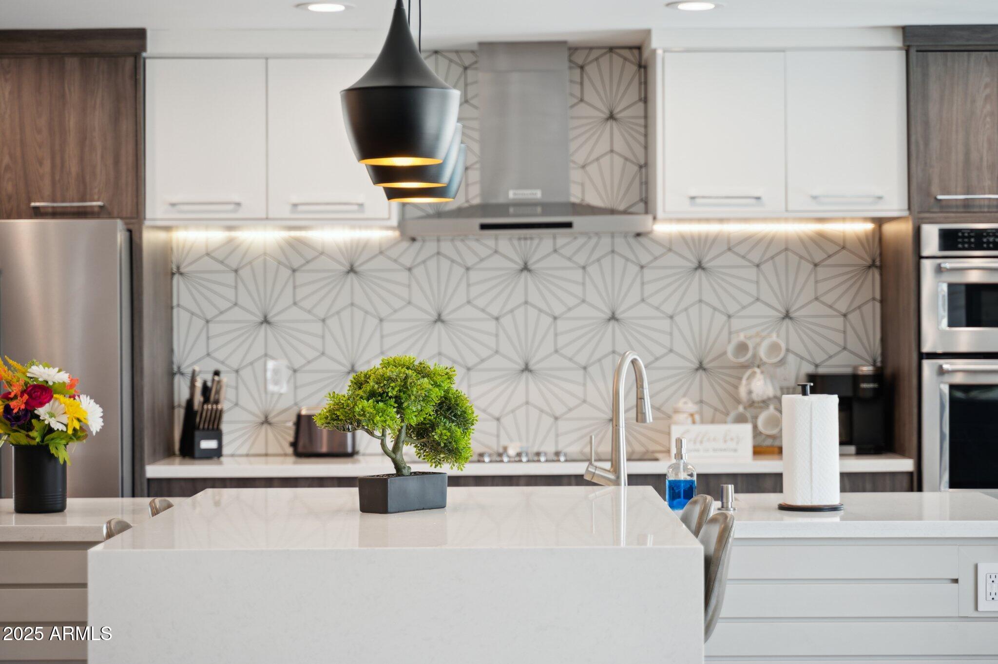 5301 East Tierra Buena Lane Scottsdale, AZ 85254 - Photo 50 of 61 a living room with fireplace furniture and a potted plant