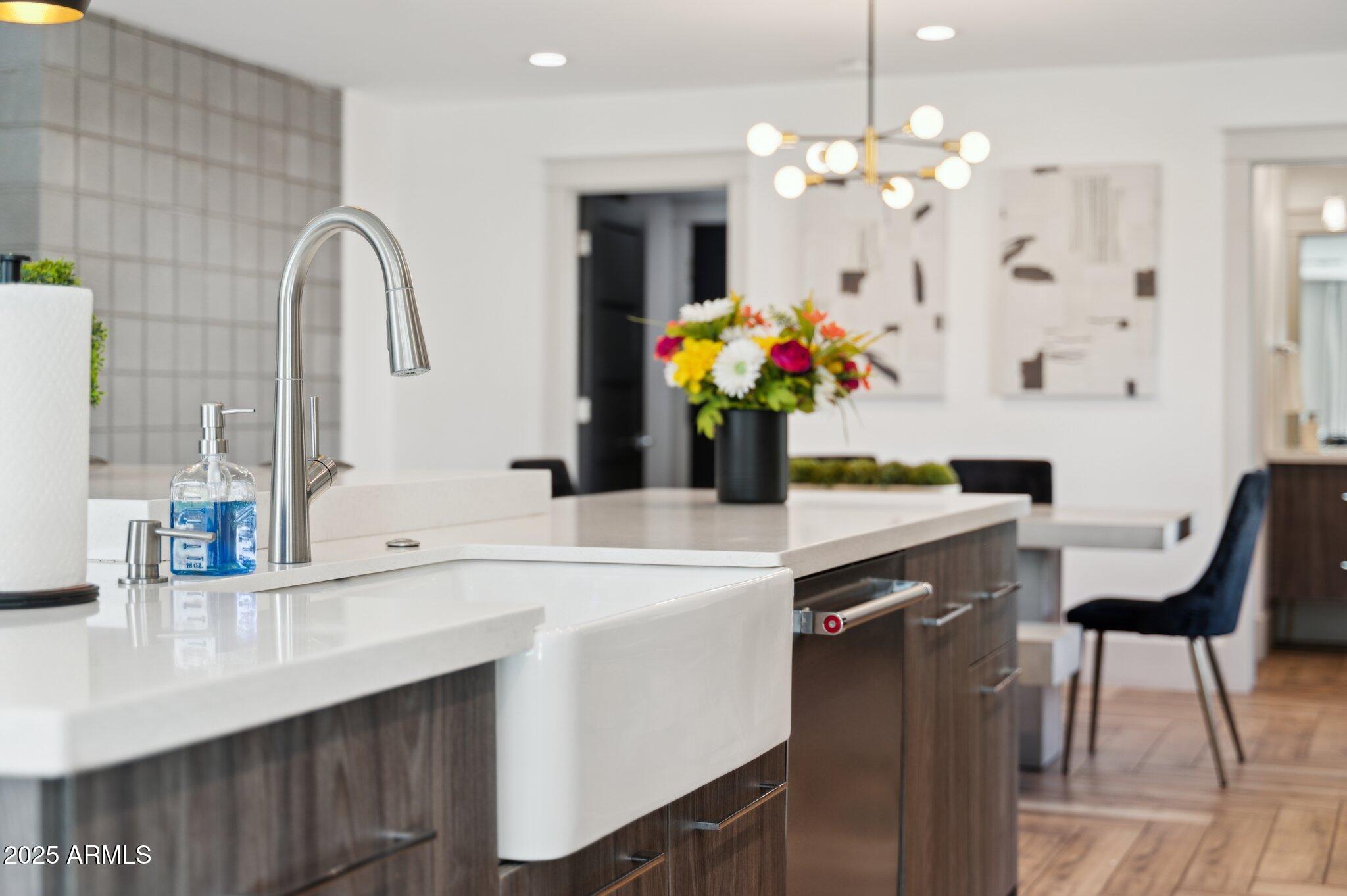5301 East Tierra Buena Lane Scottsdale, AZ 85254 - Photo 56 of 61 a view of a dining room with furniture and chandelier