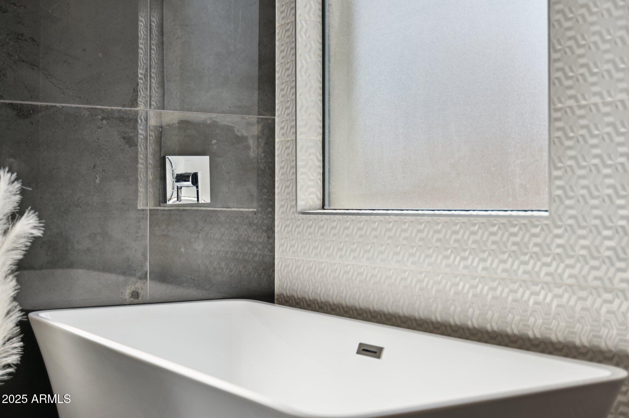 5301 East Tierra Buena Lane Scottsdale, AZ 85254 - Photo 57 of 61 a bathroom with a bathtub