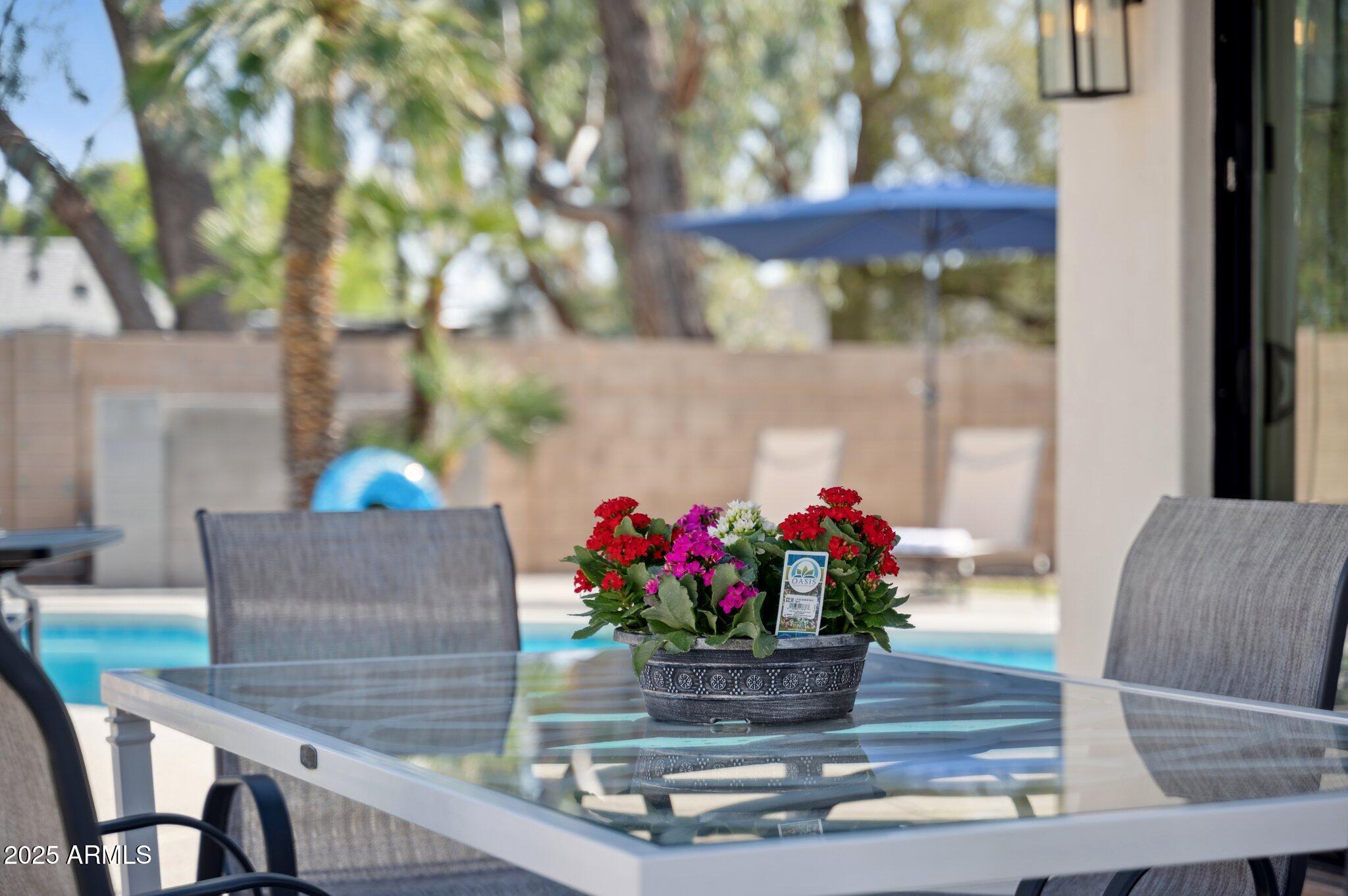 5301 East Tierra Buena Lane Scottsdale, AZ 85254 - Photo 59 of 61 a dining room with furniture and wooden floor