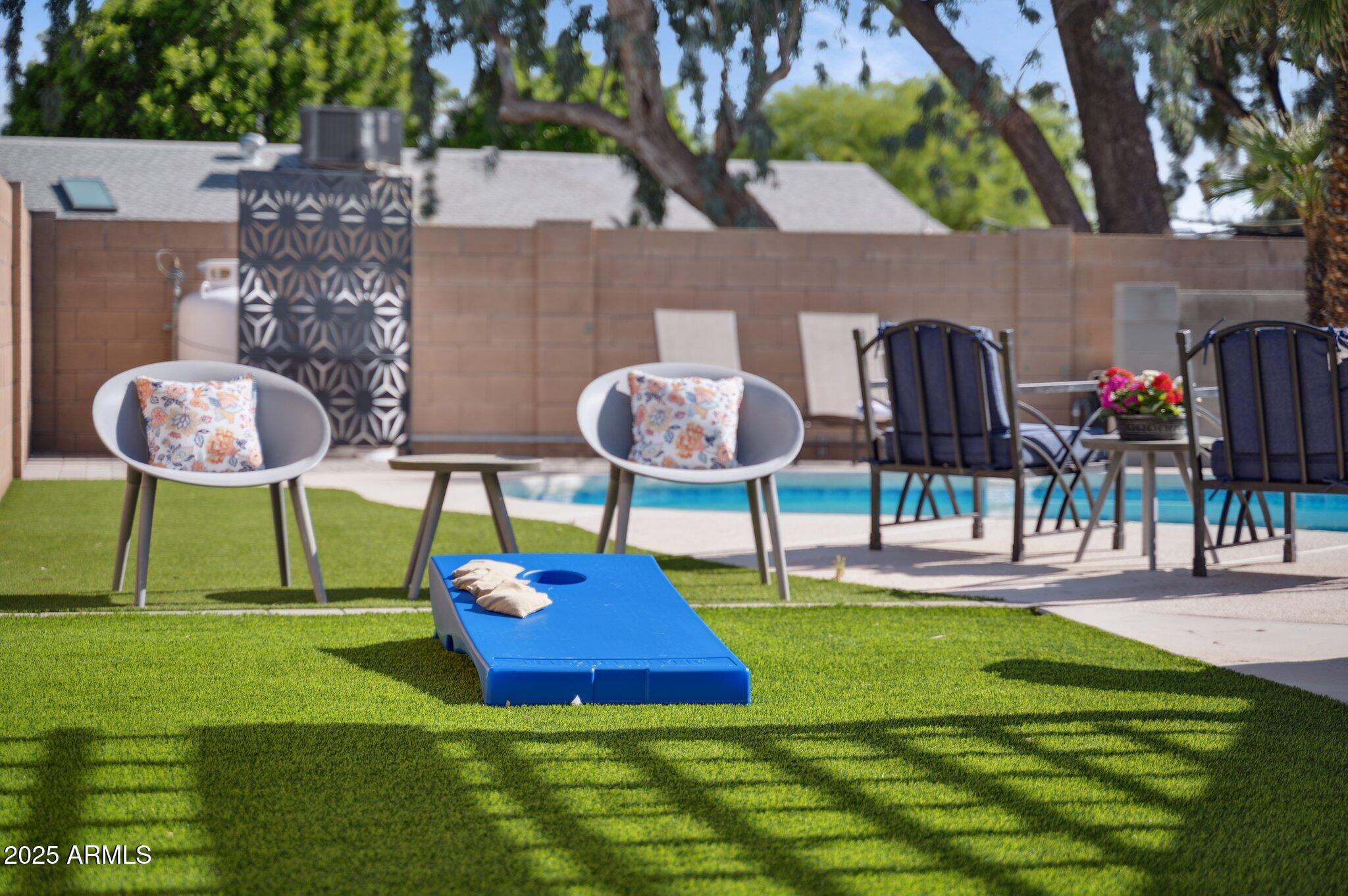 5301 East Tierra Buena Lane Scottsdale, AZ 85254 - Photo 60 of 61 a swimming pool with lots of tress in the background
