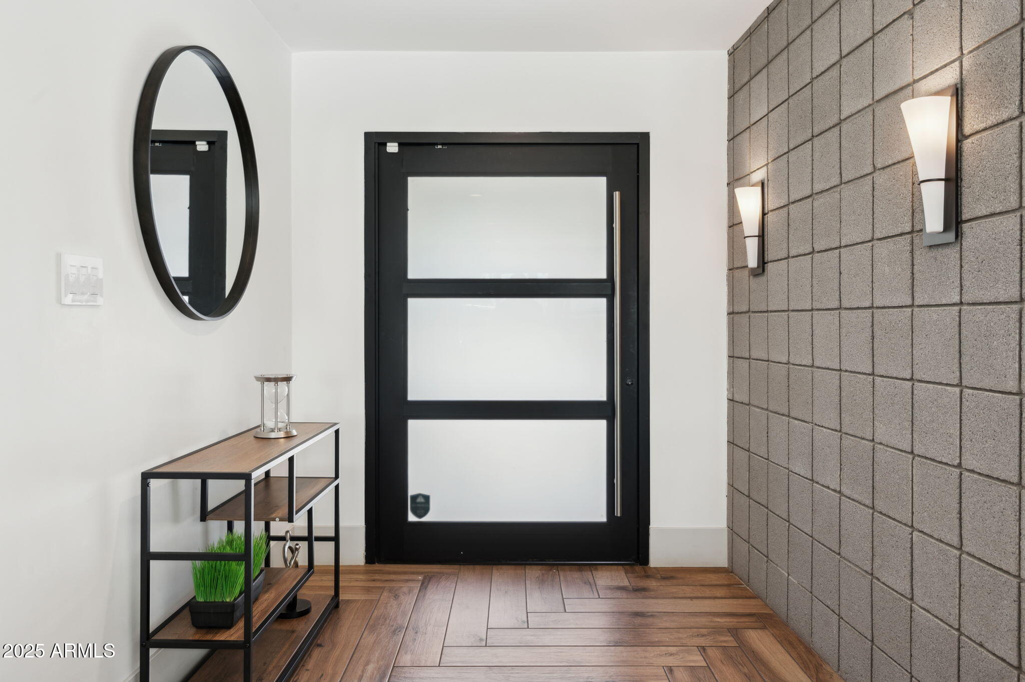 5301 East Tierra Buena Lane Scottsdale, AZ 85254 - Photo 6 of 61 a view of a hallway with wooden floor and a window
