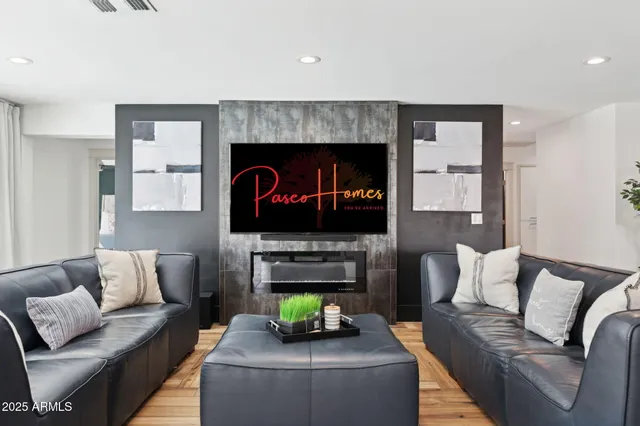 a living room with furniture and a flat screen tv