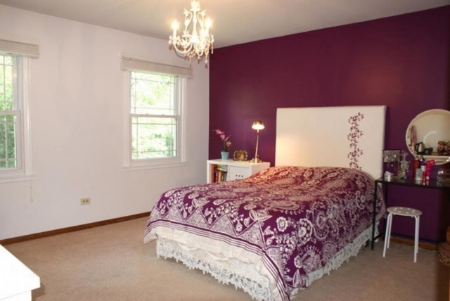 4259 Keim Road Lisle, IL 60532 - Photo 18 of 25 a bedroom with a bed and a chandelier next to a window