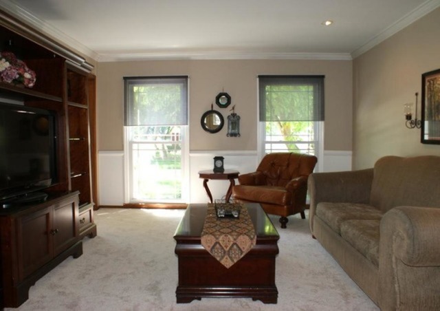 4259 Keim Road Lisle, IL 60532 - Photo 5 of 25 a living room with furniture and a flat screen tv
