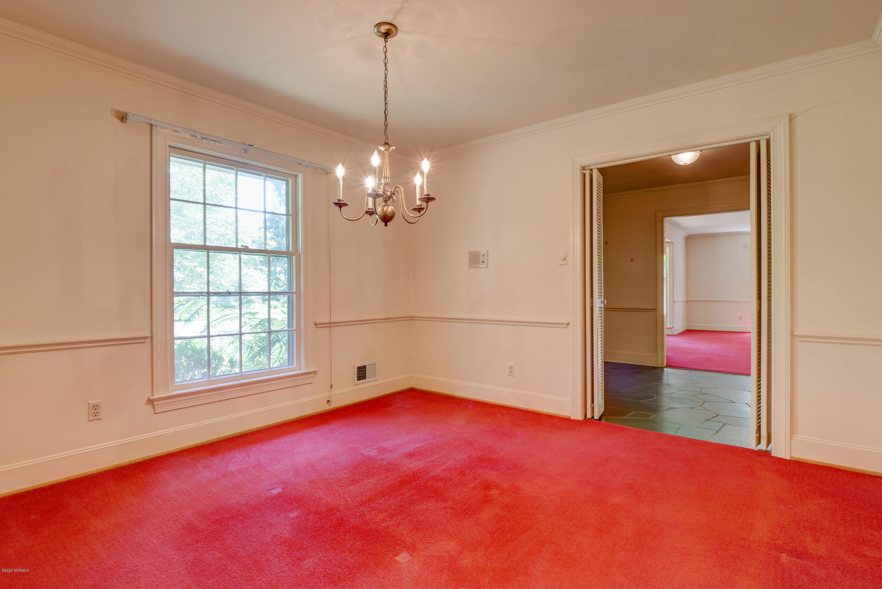 6318 Fox Run Road Wilmington, NC 28409 - Photo 13 of 46 Dining room, foyer and living room beyond.