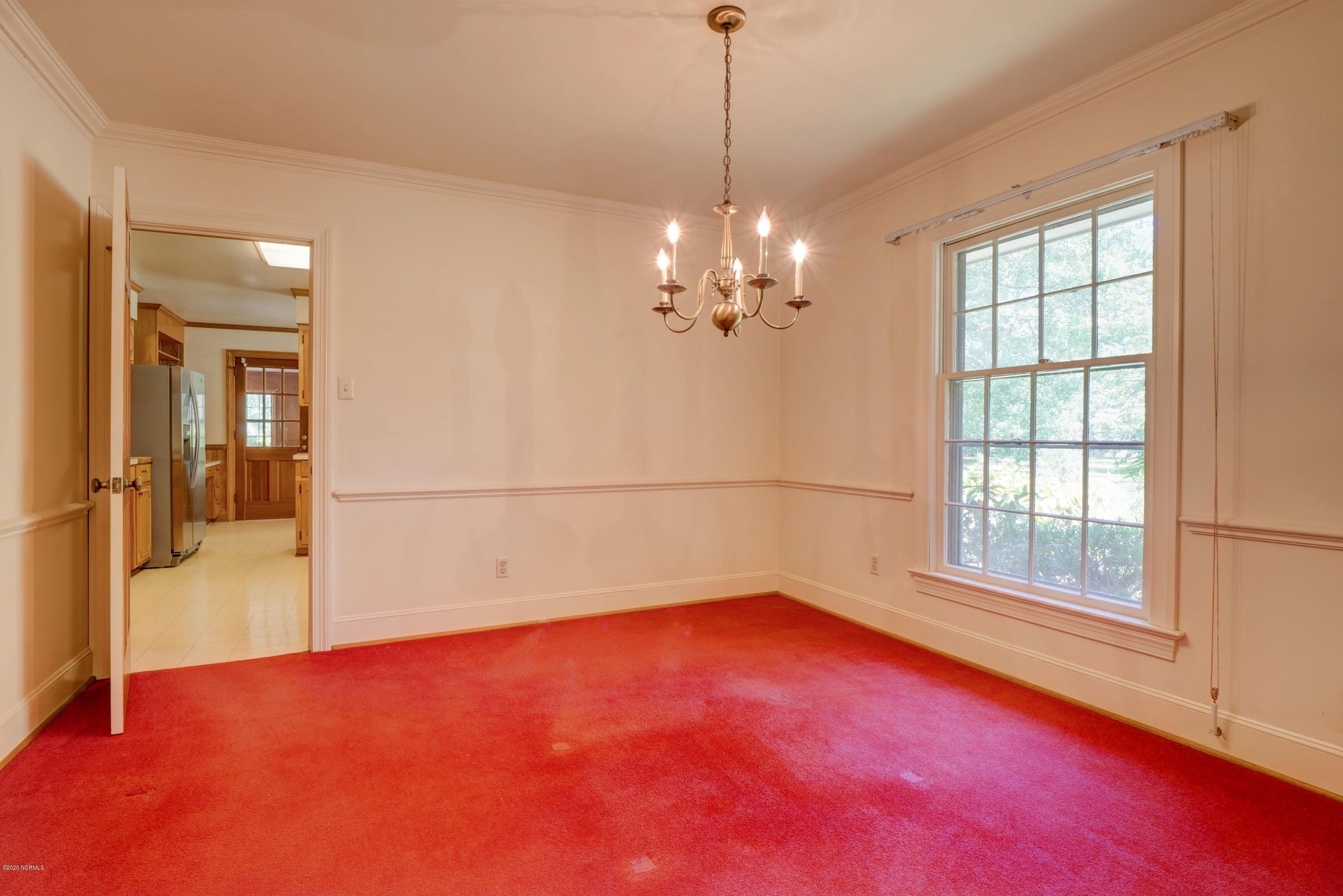 6318 Fox Run Road Wilmington, NC 28409 - Photo 14 of 46 Dining room, kitchen beyond.
