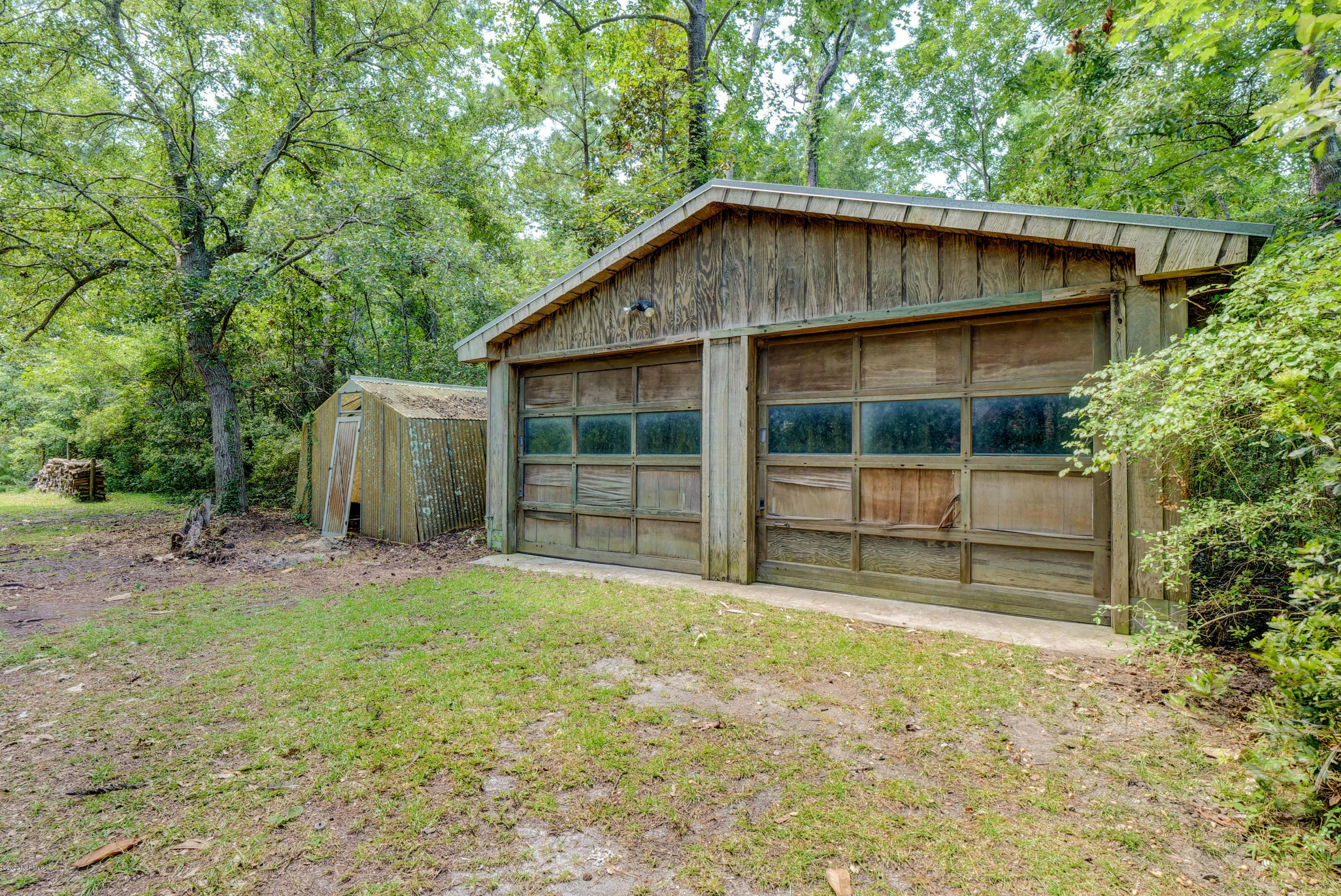 6318 Fox Run Road Wilmington, NC 28409 - Photo 35 of 46 Detached garage and greenhouse.
