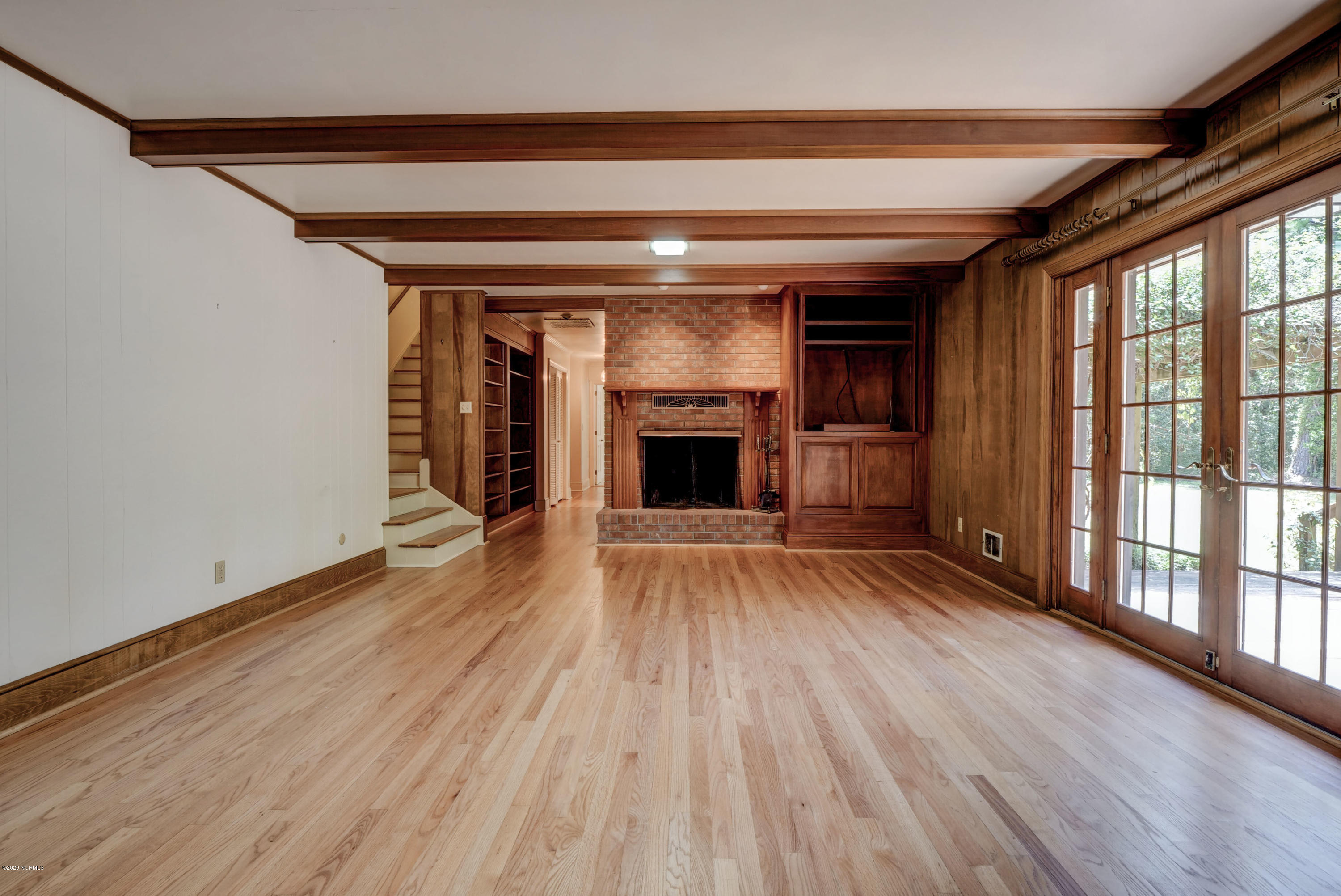 6318 Fox Run Road Wilmington, NC 28409 - Photo 7 of 46 Family room and wood-burning fireplace.