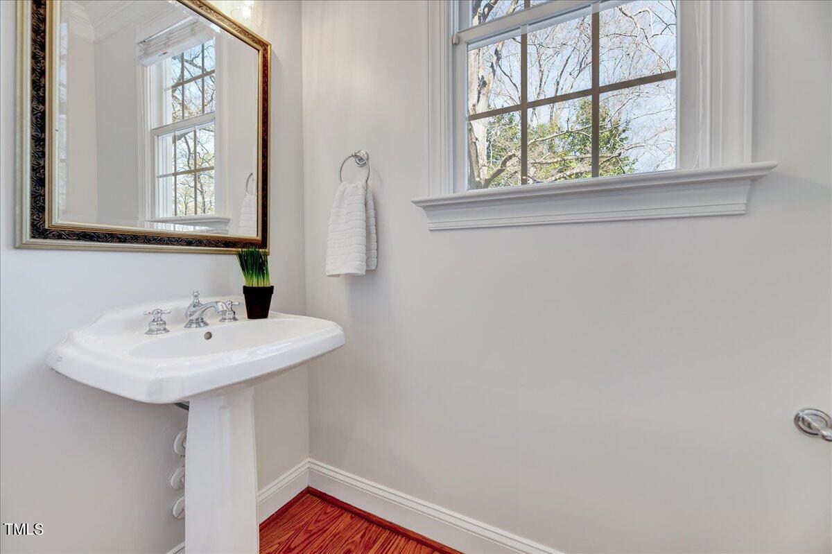 201 Brooks Avenue Raleigh, NC 27607 - Photo 13 of 44 a bathroom with a sink and a mirror