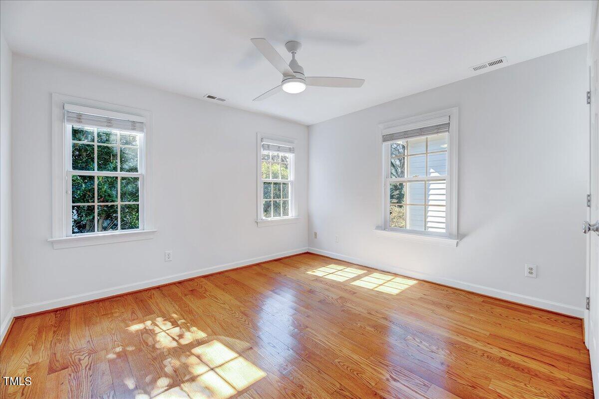 201 Brooks Avenue Raleigh, NC 27607 - Photo 14 of 44 wooden floor in an empty room with a window
