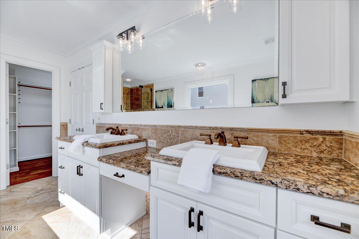 201 Brooks Avenue Raleigh, NC 27607 - Photo 22 of 44 a bathroom with a sink and a mirror