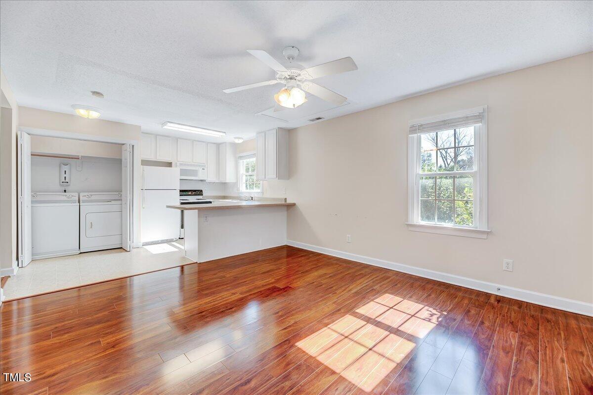 201 Brooks Avenue Raleigh, NC 27607 - Photo 26 of 44 a view of kitchen with sink and wooden floor