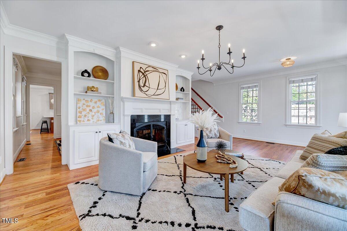 201 Brooks Avenue Raleigh, NC 27607 - Photo 5 of 44 a living room with furniture and a fireplace