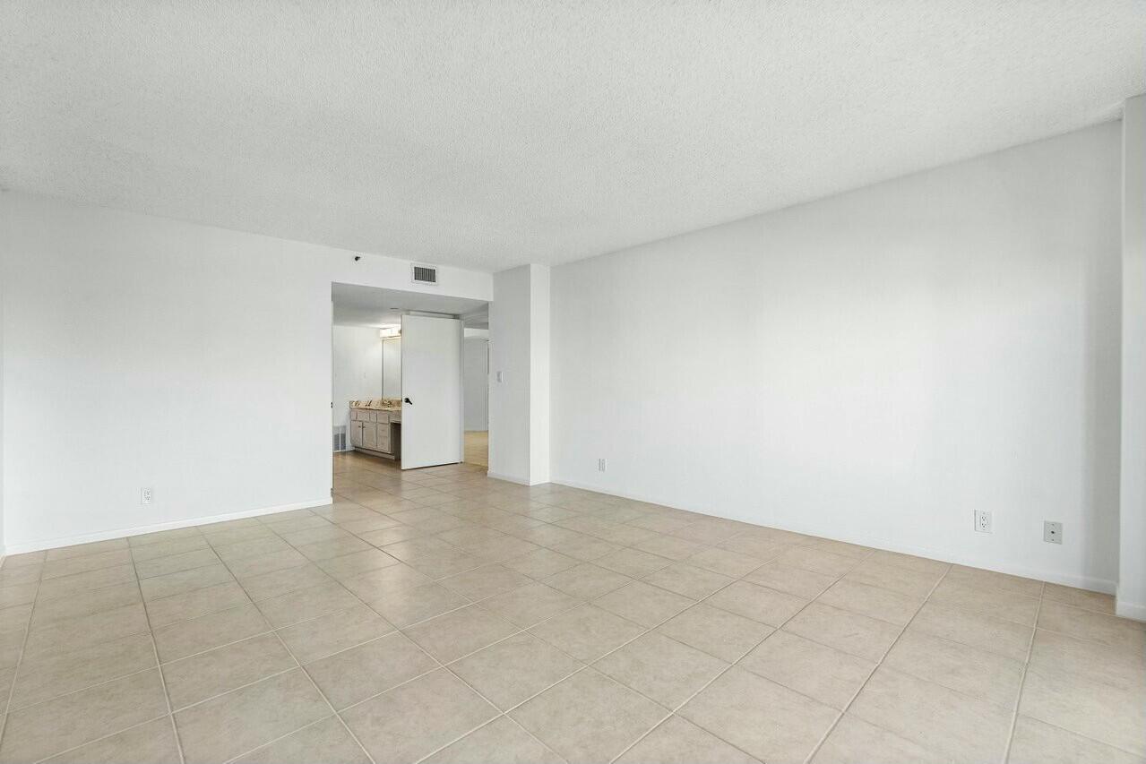 4001 North Ocean Boulevard, Unit 1503 Boca Raton, FL 33431 - Photo 23 of 46 an empty room with a natural light