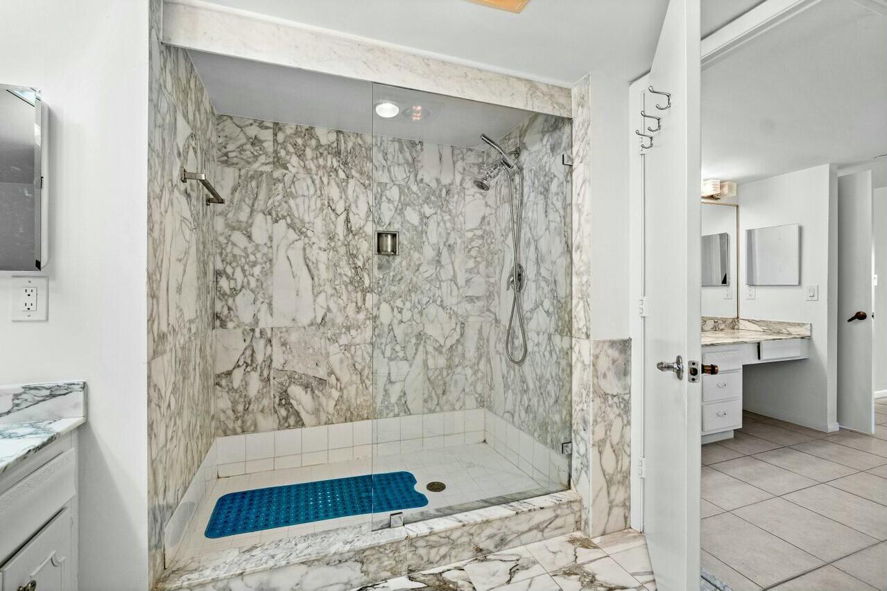 4001 North Ocean Boulevard, Unit 1503 Boca Raton, FL 33431 - Photo 27 of 46 a bathroom with a bathtub sink and toilet