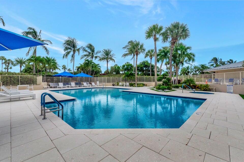 4001 North Ocean Boulevard, Unit 1503 Boca Raton, FL 33431 - Photo 38 of 46 a swimming pool with chairs