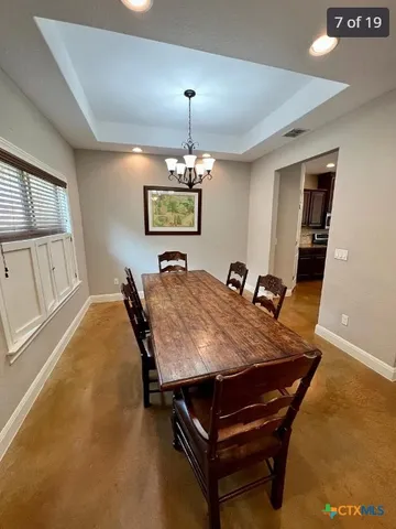 a bed room with furniture and a chandelier