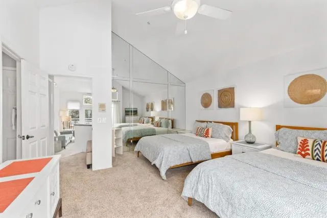 892 Del Mar Downs Road Solana Beach, CA 92075 - Photo 11 of 19 a bedroom with two beds and painted walls