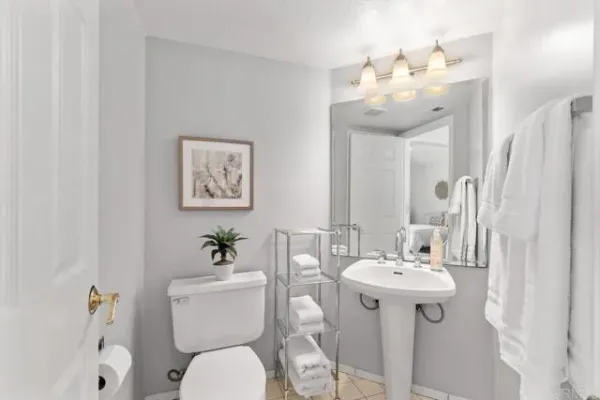 a bathroom with a sink vanity granite and a mirror