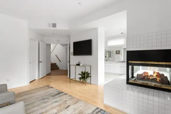 a bathroom with a tub a sink a mirror and a shower