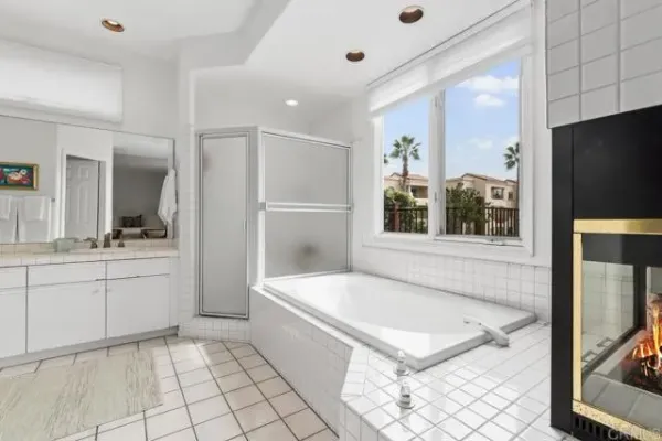 a bathroom with double sink and a mirror