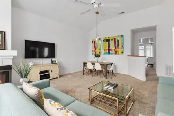 a large kitchen with a refrigerator a sink a stove a washer and dryer