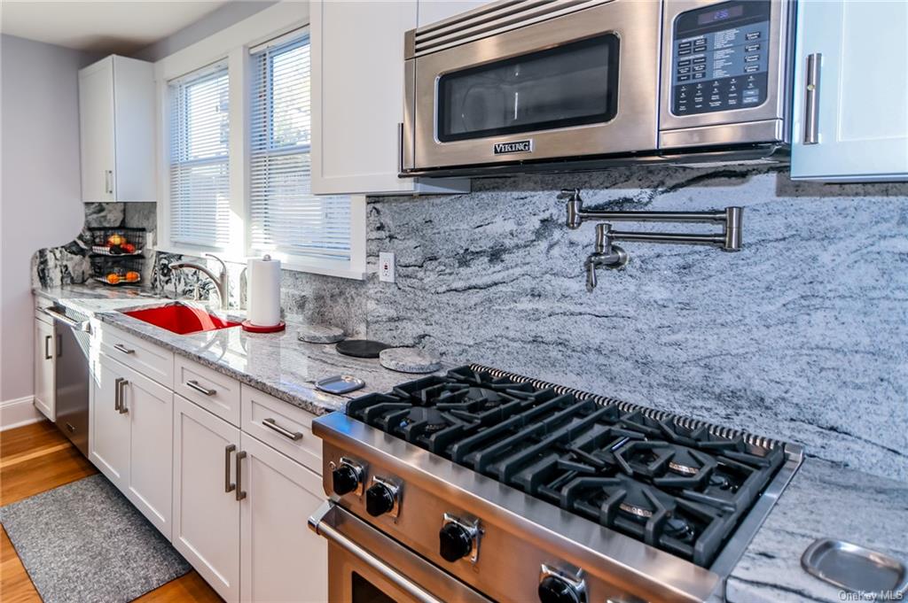 a kitchen with a stove and a microwave