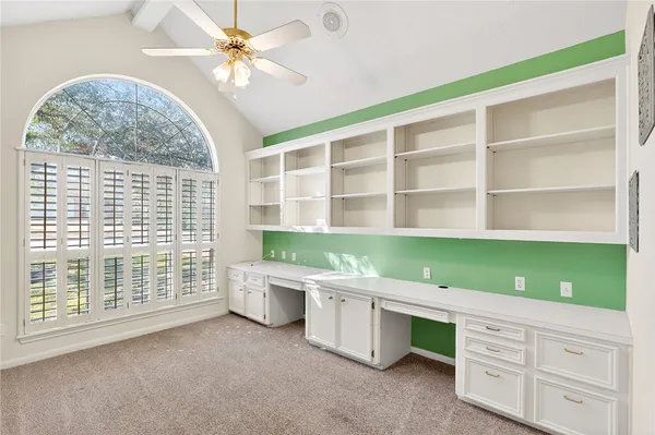 a room with cabinets and a window
