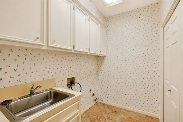 a bathroom with a sink and cabinets