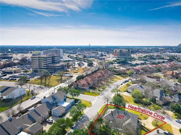 an aerial view of residential building and lake
