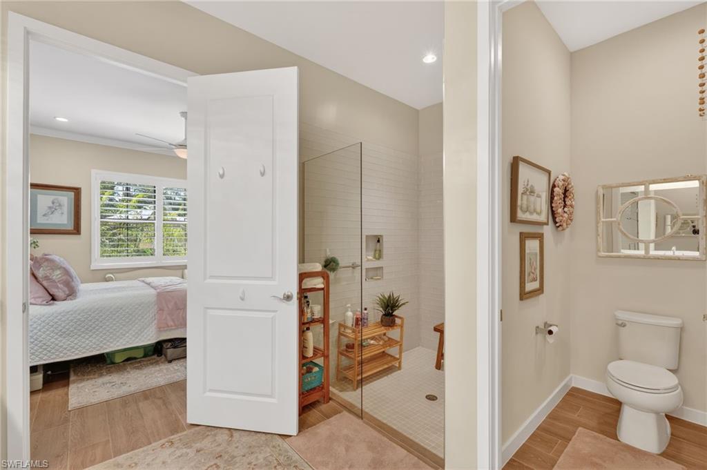 14628 Kingfisher Loop Naples, FL 34120 - Photo 16 of 39 a bathroom with a sink toilet and shower