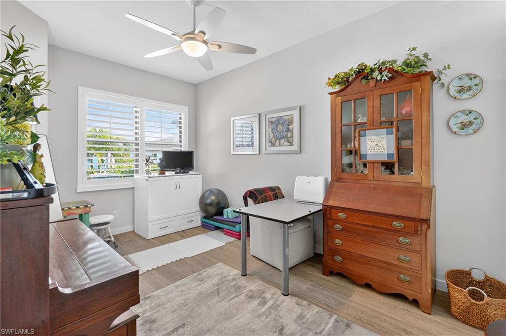 14628 Kingfisher Loop Naples, FL 34120 - Photo 18 of 39 a living room with furniture and window