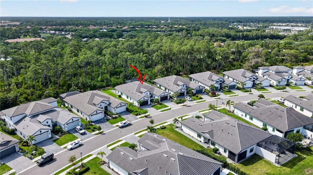 14628 Kingfisher Loop Naples, FL 34120 - Photo 34 of 39 an aerial view of a city