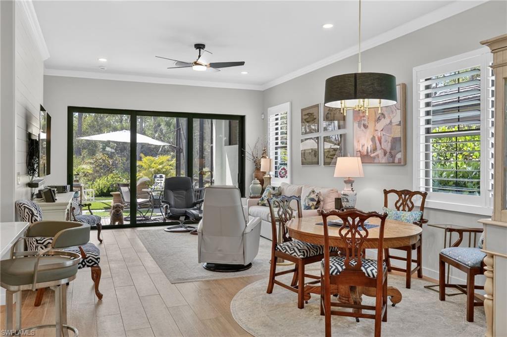 14628 Kingfisher Loop Naples, FL 34120 - Photo 5 of 39 a very nice looking living room with furniture and a large window