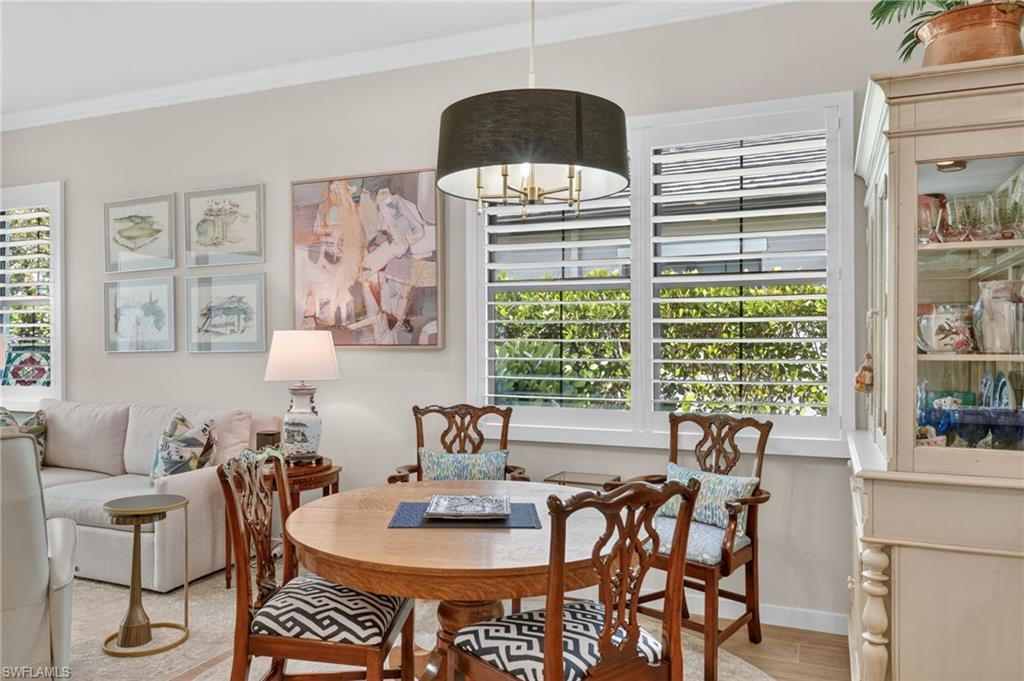 14628 Kingfisher Loop Naples, FL 34120 - Photo 8 of 39 a dining room with furniture and window