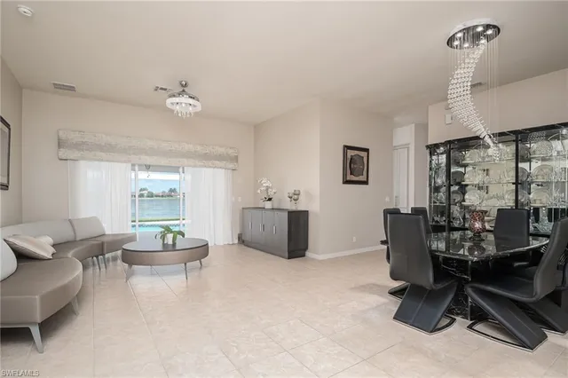 a view of a livingroom with workspace and a couch