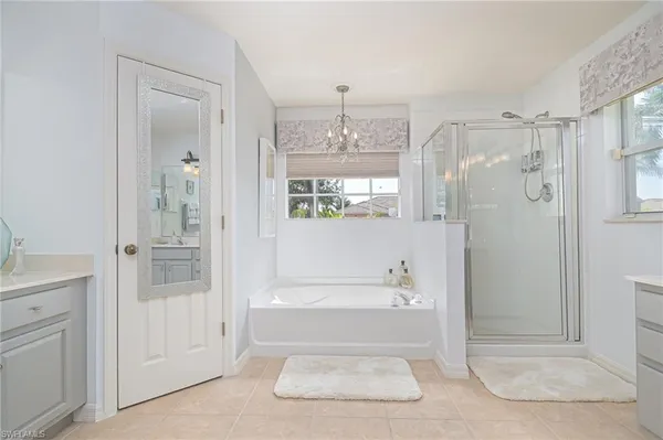 a bathroom with a bathtub and a shower