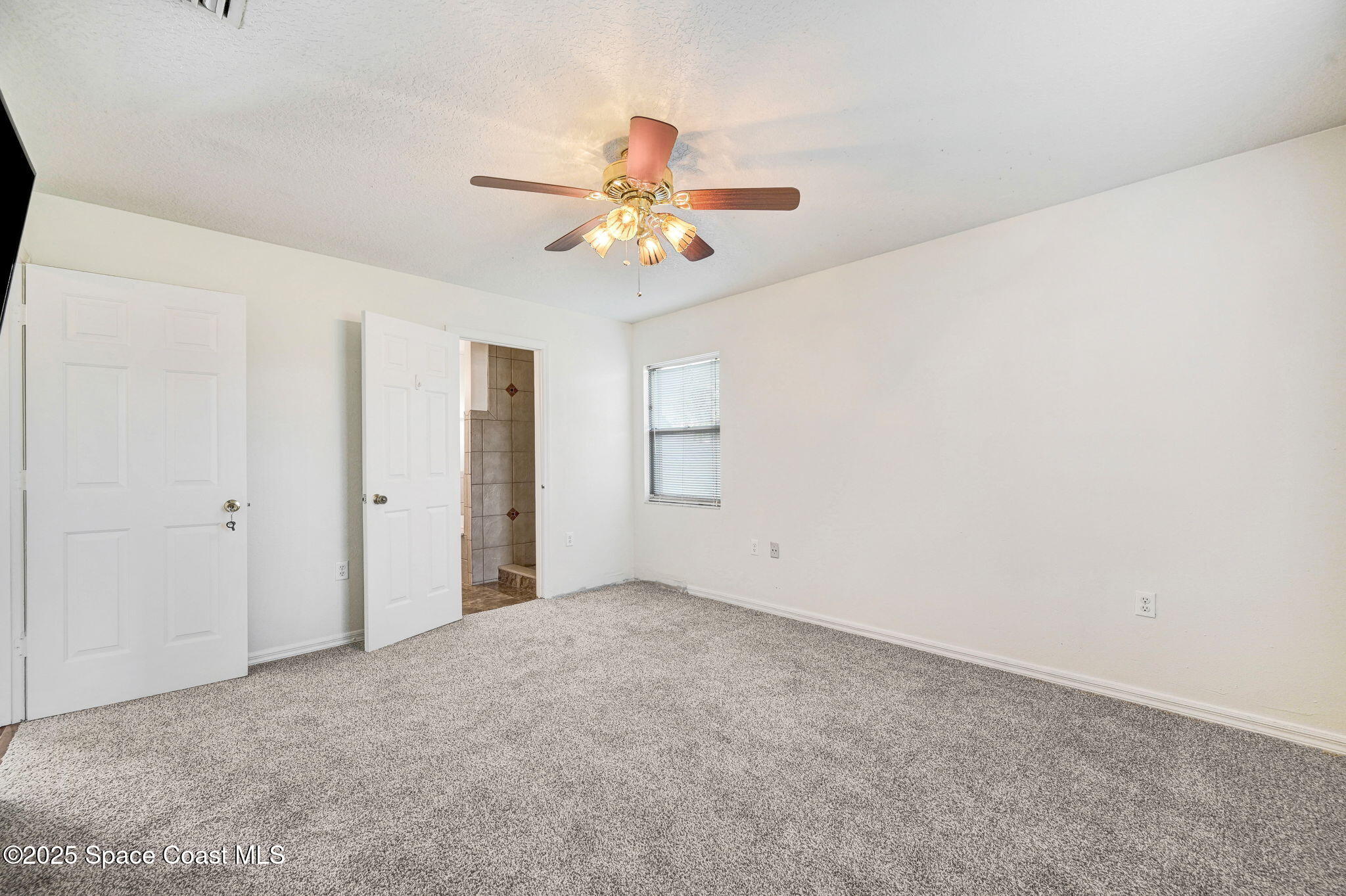 6094 Cardiff Avenue Cocoa, FL 32927 - Photo 26 of 48 a view of an empty room with a window