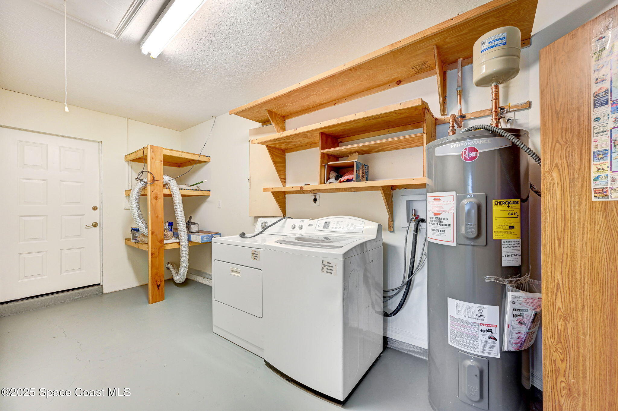 6094 Cardiff Avenue Cocoa, FL 32927 - Photo 32 of 48 a utility room with dryer and washer