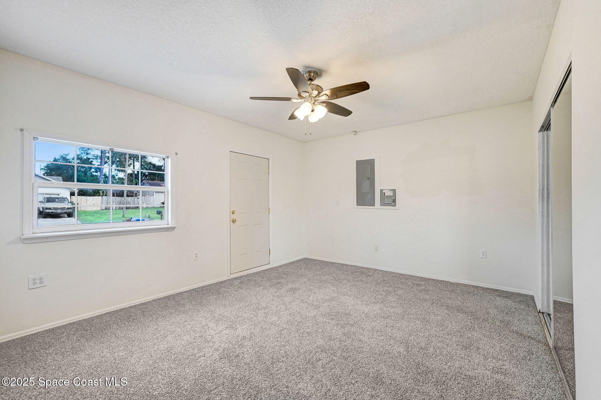 6094 Cardiff Avenue Cocoa, FL 32927 - Photo 33 of 48 a view of an empty room with a window