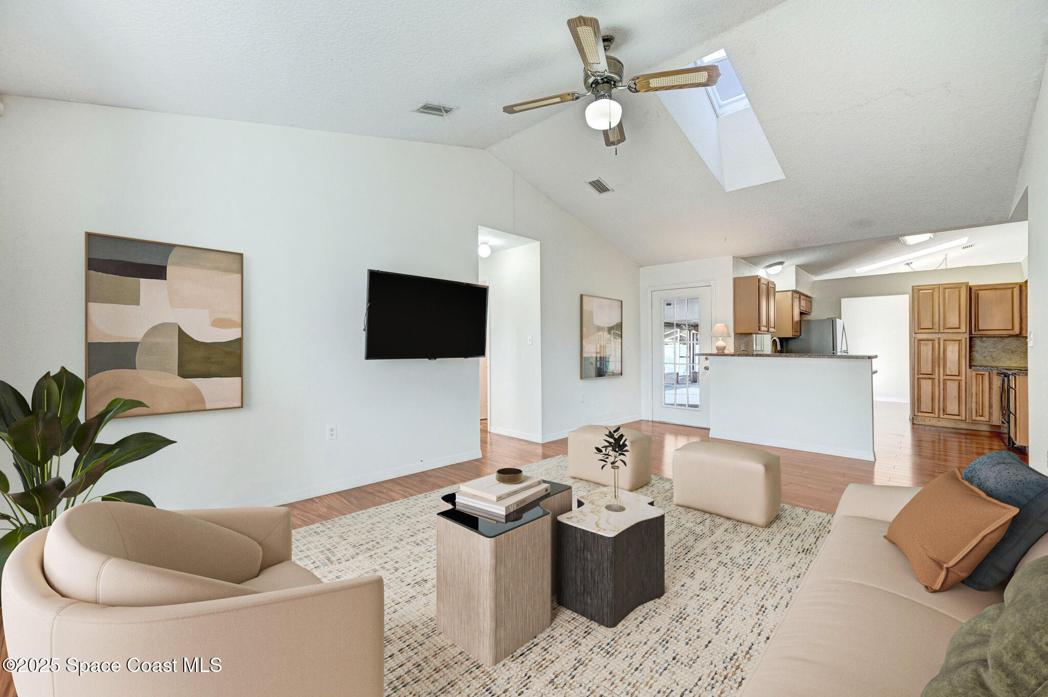 6094 Cardiff Avenue Cocoa, FL 32927 - Photo 4 of 48 a living room with furniture and a flat screen tv
