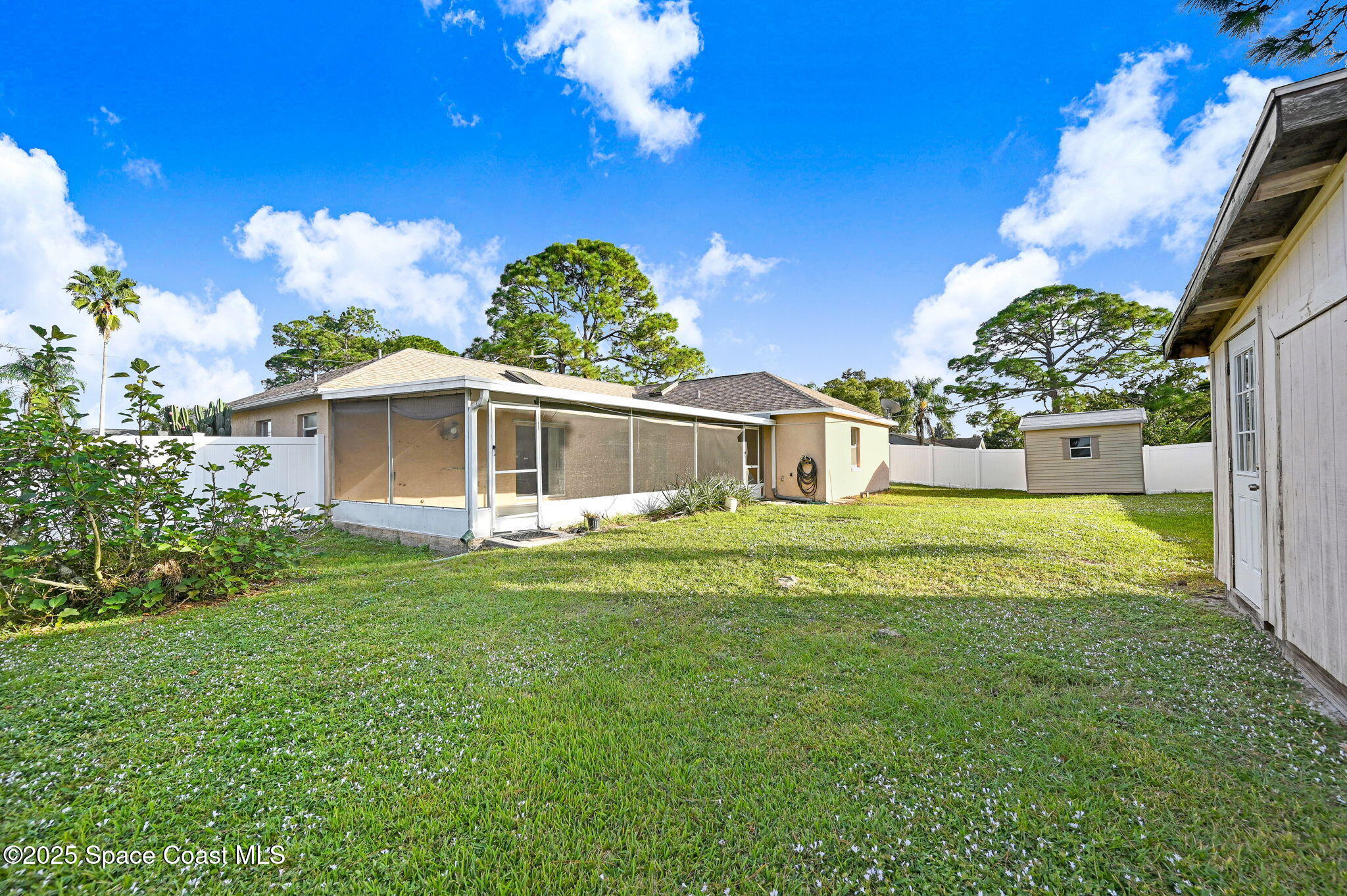 6094 Cardiff Avenue Cocoa, FL 32927 - Photo 42 of 48 a front view of a house with garden