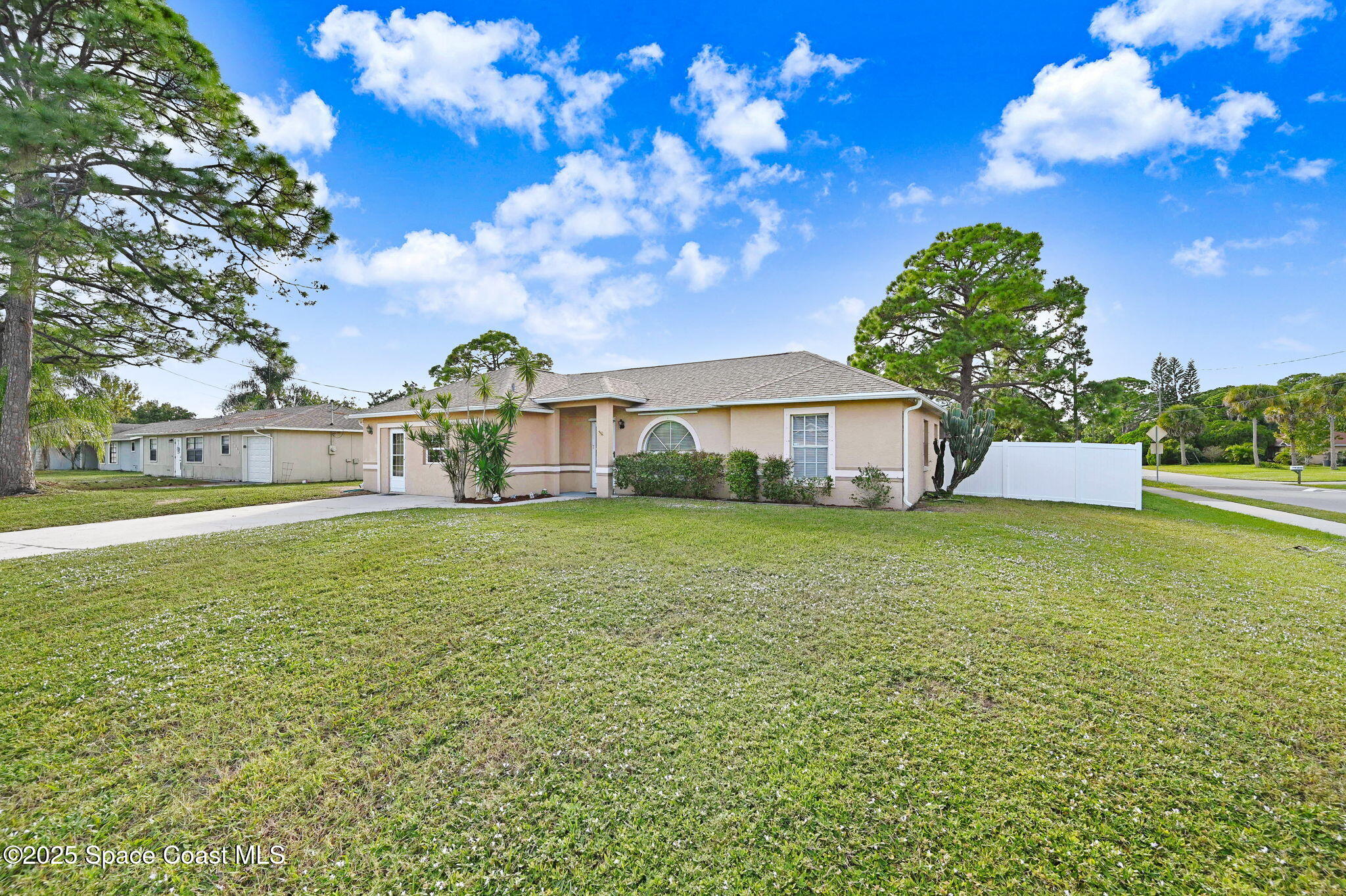 6094 Cardiff Avenue Cocoa, FL 32927 - Photo 43 of 48 a front view of a house with garden